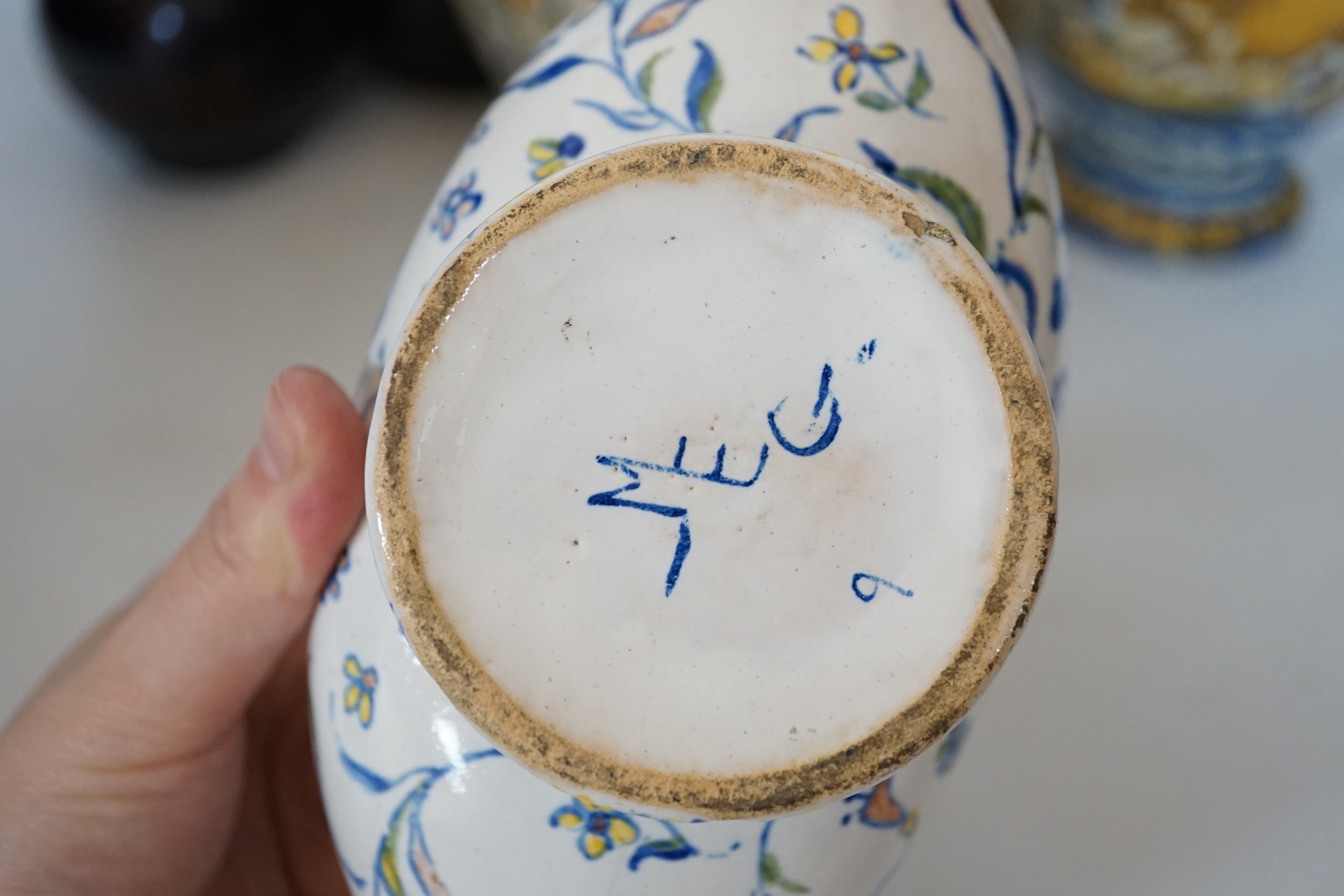 A Slavonic three section brown glazed earthenware puzzle jug and pair of 19th century Portuguese lizard handle maiolica vases and two other similar items, largest 28cm high